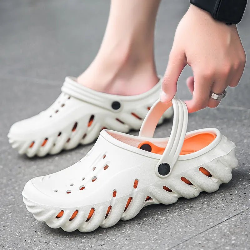 Beige men's EVA slipper sandals with hollow out pattern and non-slip sole.