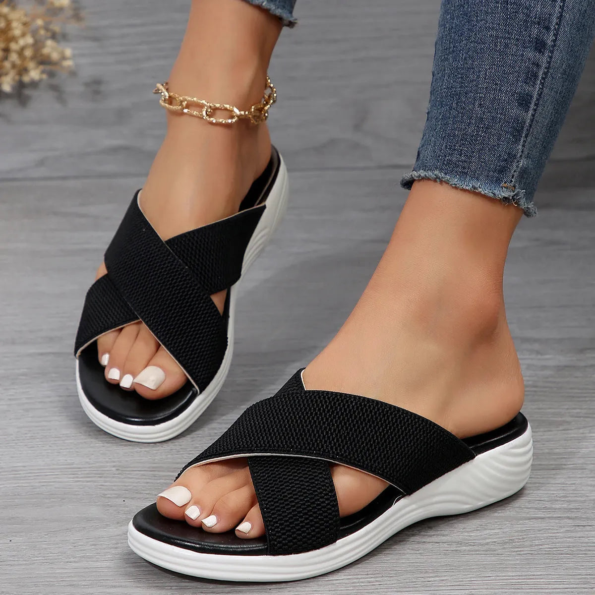 Women's black wedge slippers with peep-toe and cross-strap on thick rubber sole