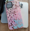 Transparent TPU phone case for iPhone 12 and 14 Pro Max with pink and blue petal pattern.