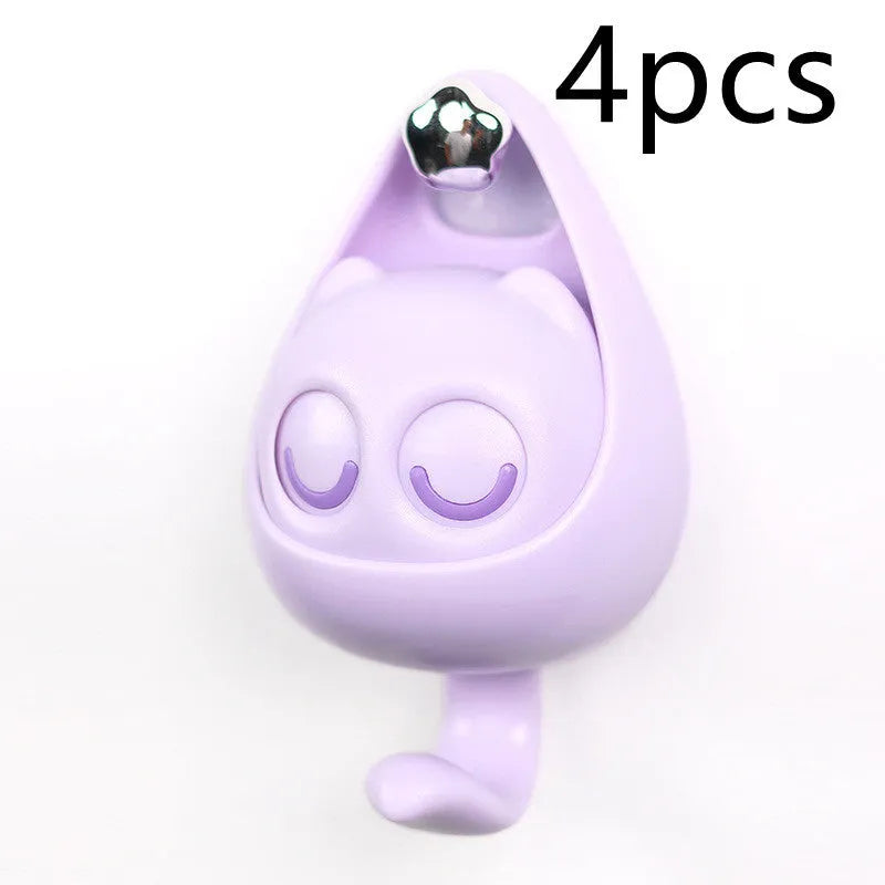 Cream white cat-shaped adhesive wall hook with winking eyes, 2.5kg capacity, 105x61x45mm