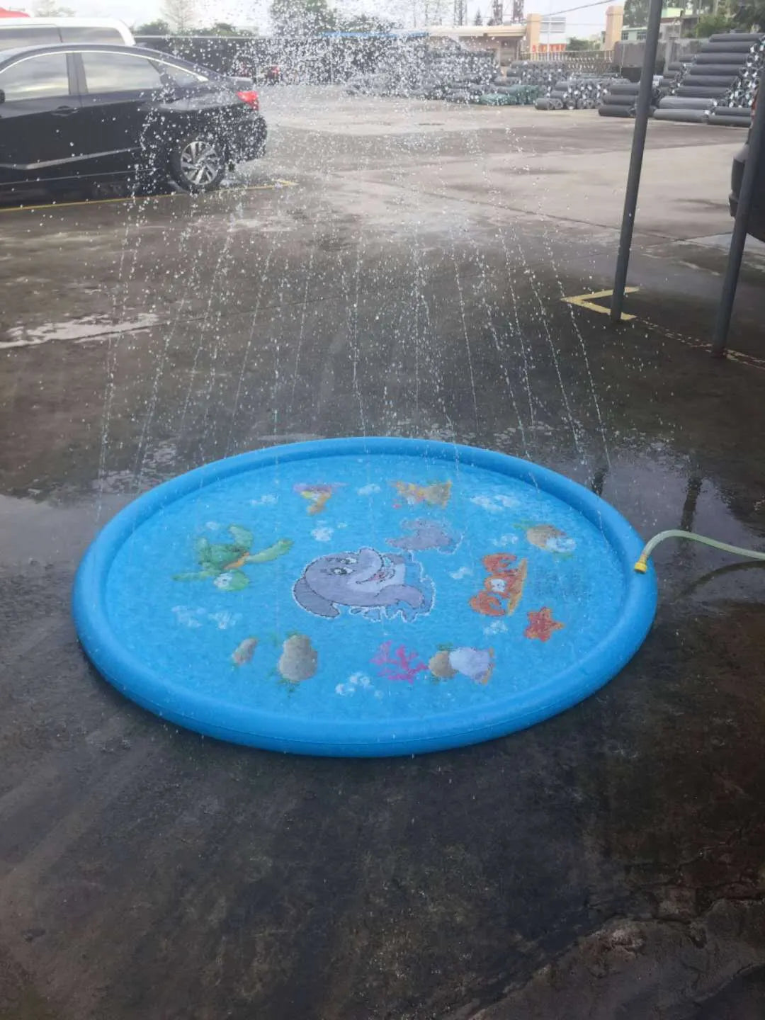 Blue PVC children's water spray play mat with marine animal graphics, measuring 100cm by 170cm