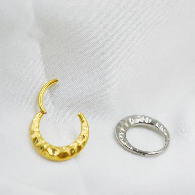 Titanium alloy concave-convex nose ring in gold or silver finish with 1.2mm thickness and 8mm or 10mm diameter options