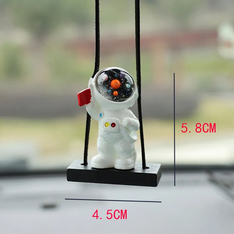 Resin cartoon astronaut car pendant in five designs: telescope, red flag, radish, headrest, and resting astronaut