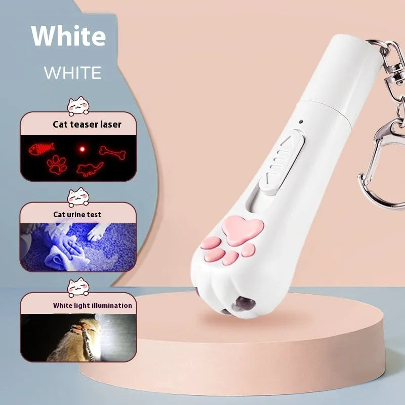 Pink automatic cat teaser toy with a wand attachment on a hardwood floor, showing compact circular base.