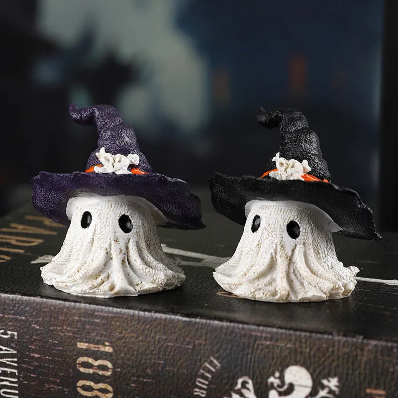 A purple and a black solid resin wizard hat ornament for holiday decoration.