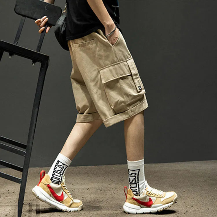 Men's cotton cargo shorts in khaki with multiple pockets and tie-cord front closure