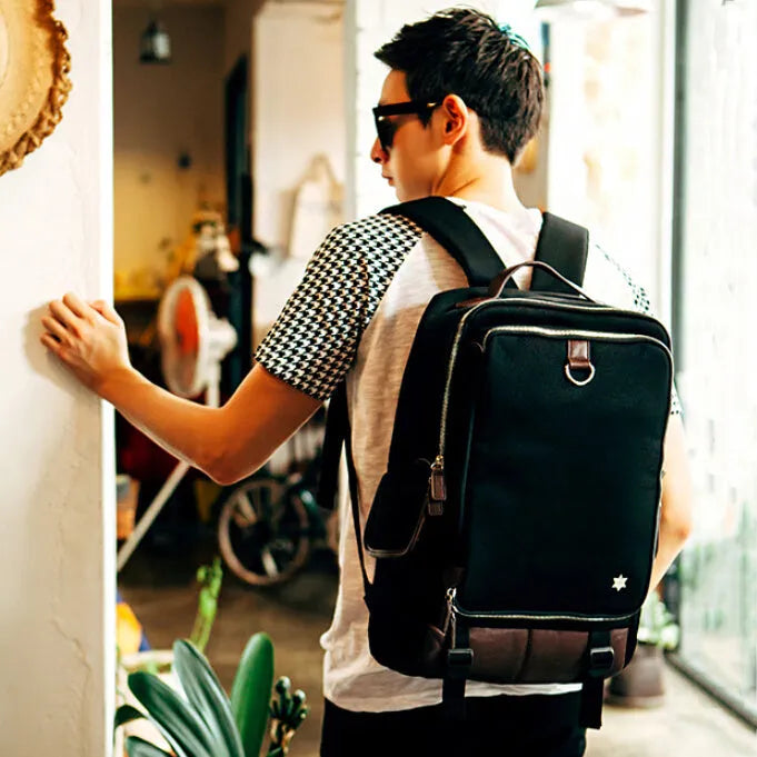 Men's large backpack in durable Oxford fabric, shown in army green colour, dimensions 30cm by 16cm by 46cm.