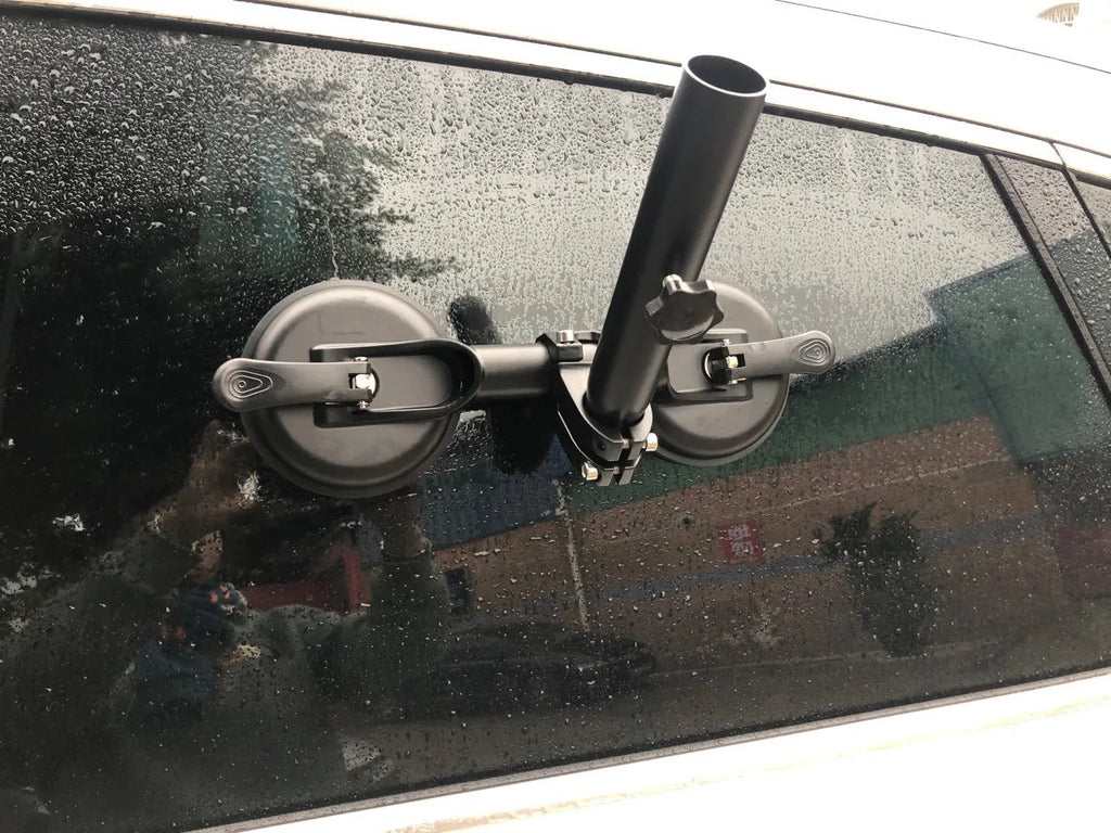 Black off-road car glass sucker base with round rubber disc for windscreen mounting.