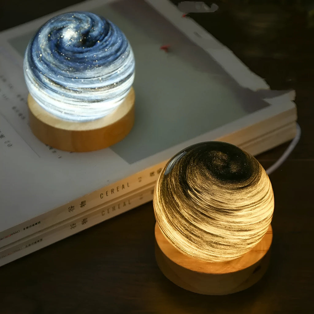 Modern simple style planet night light with USB plug and electrodeless dimming on its base.