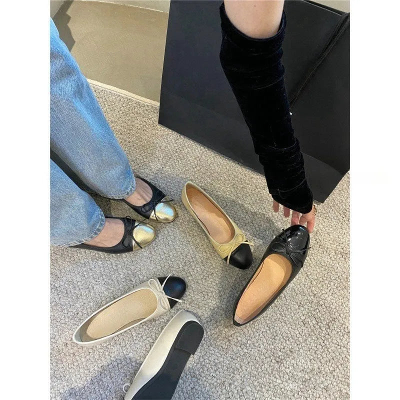 Women's apricot colour ballet flat pumps with a round toe and flat rubber sole.