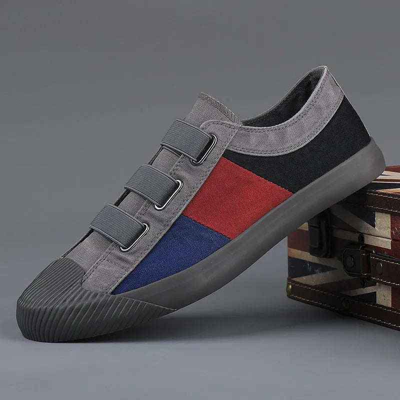 Men's low-top canvas sneakers in beige with colour stitching and an elastic band closure.