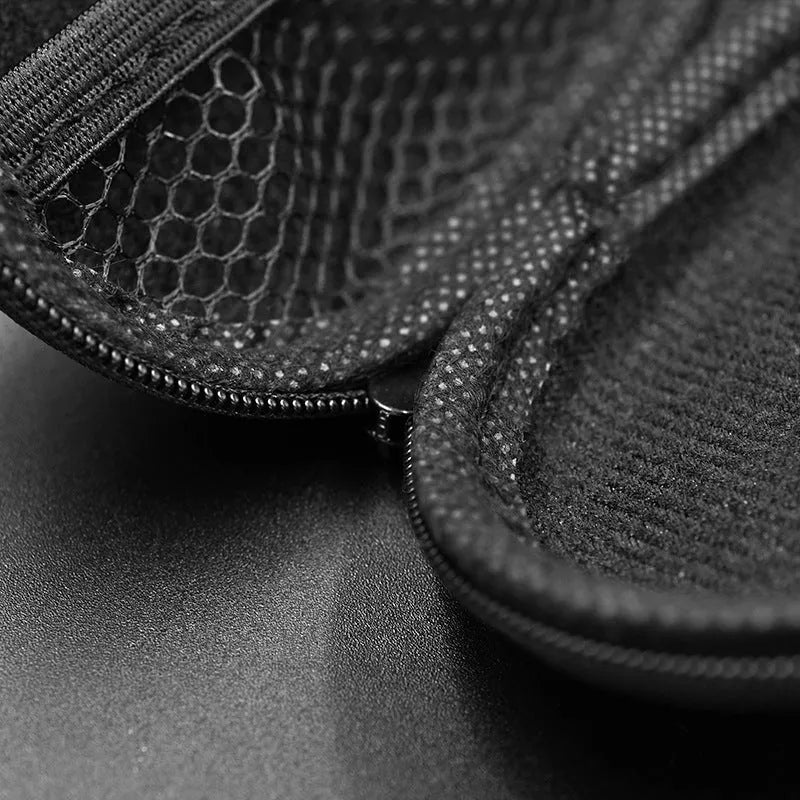 Black oval leather earphone storage bag with a zip closure, open to show soft-lined interior.