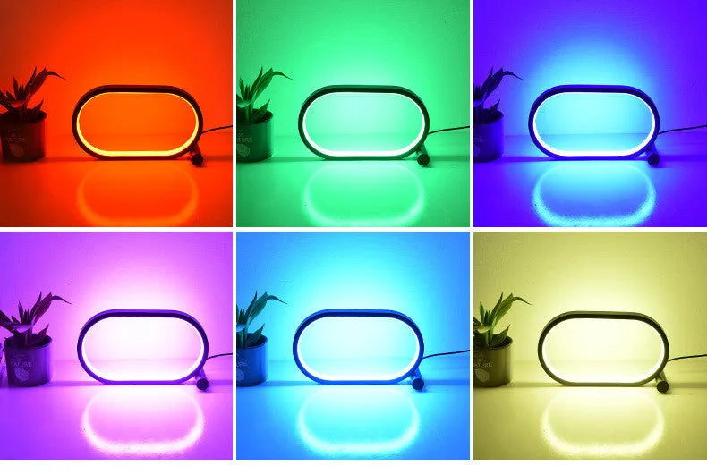 USB plug-in oval acrylic touch control night light with metal base, black finish, on a bedside table