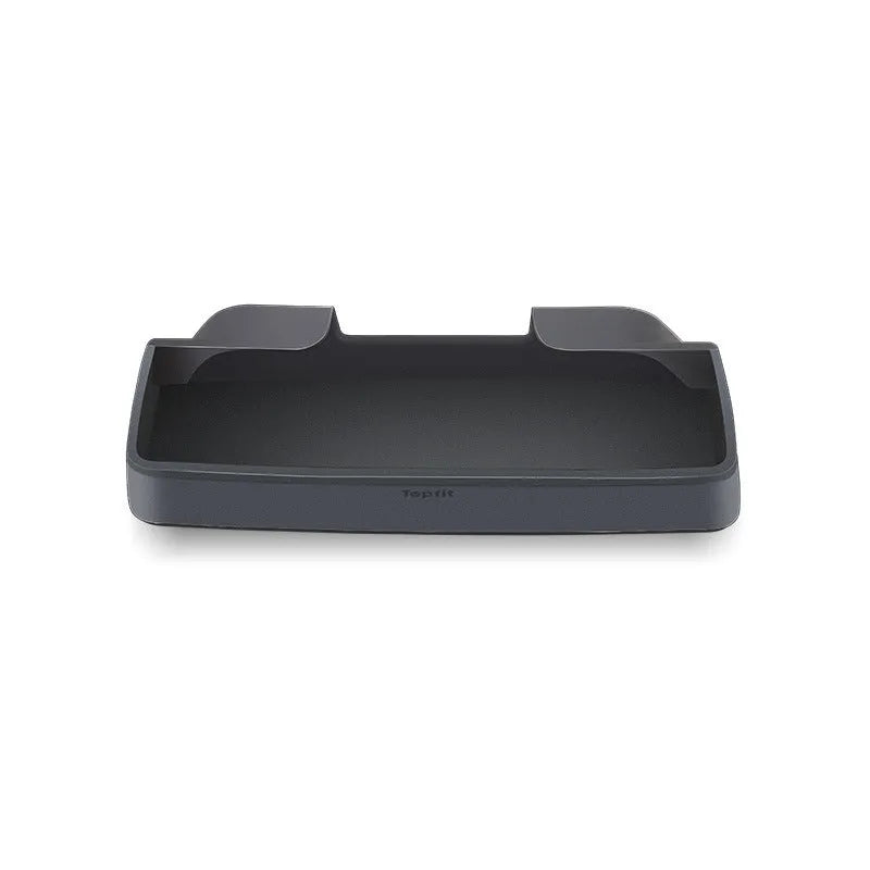 Black silicone glasses case installed inside a Tesla Model 3 or Y centre console armrest.