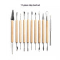11-piece clay sculpting tool set with wooden handles and stainless steel heads on a blue felt bag.