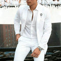 Men's white slim fit two-piece wedding suit on a hanger.