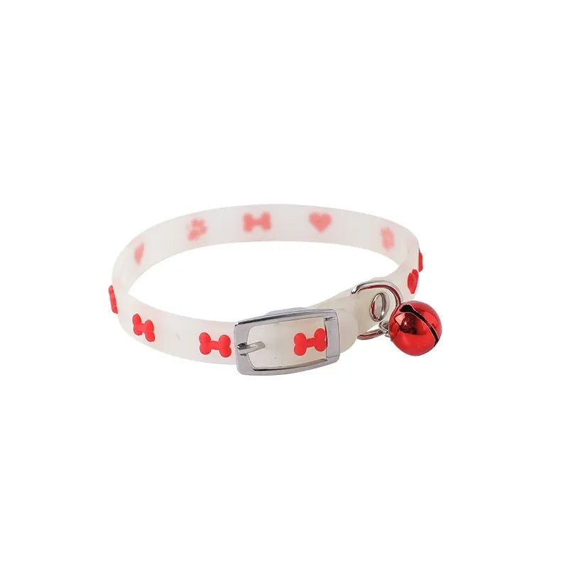 A luminous cat collar with an adjustable 29cm silicone rope and a metal bell, shown in one of four possible patterns.