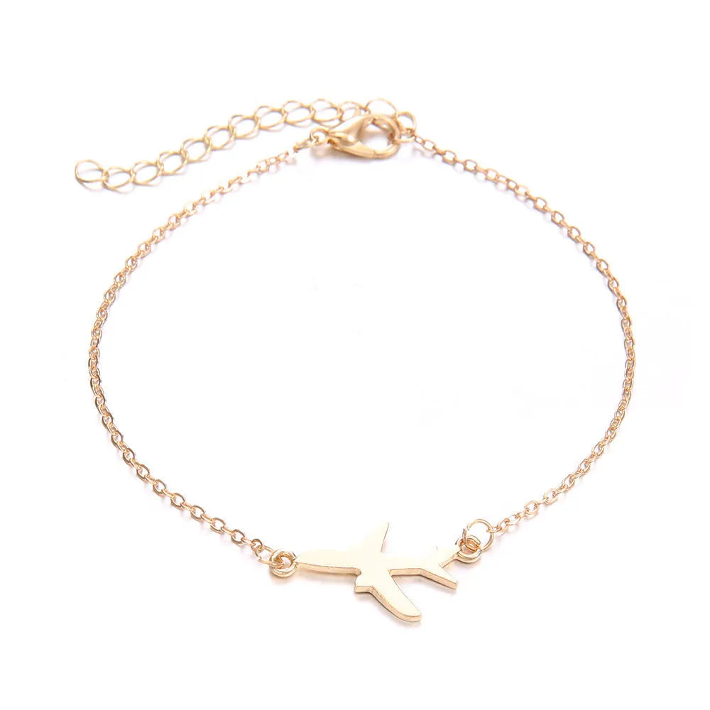 Three bohemian bracelets with heart-shaped aircraft map charms in alloy construction