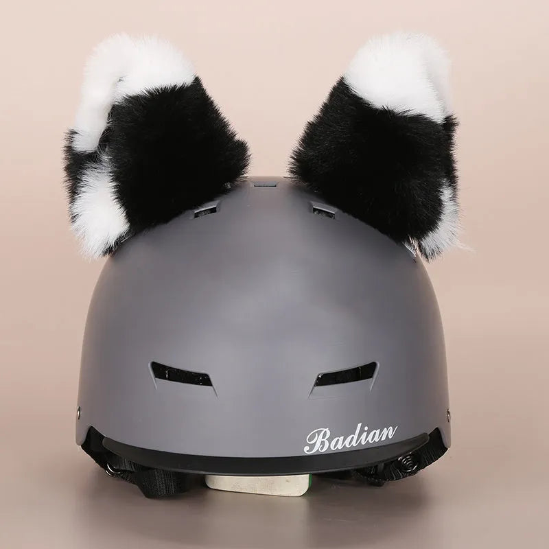 Colourful plush cartoon hat decoration sitting on top of a ski helmet