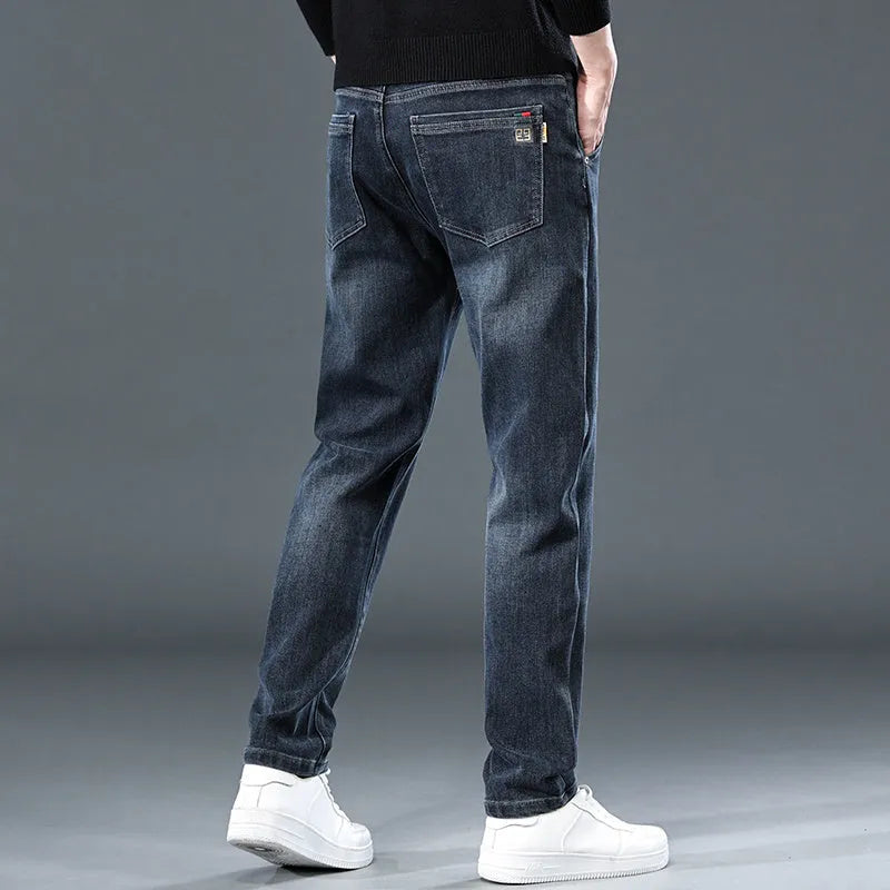 Men's slim straight casual trousers in blue grey, showing loose fit and street style.