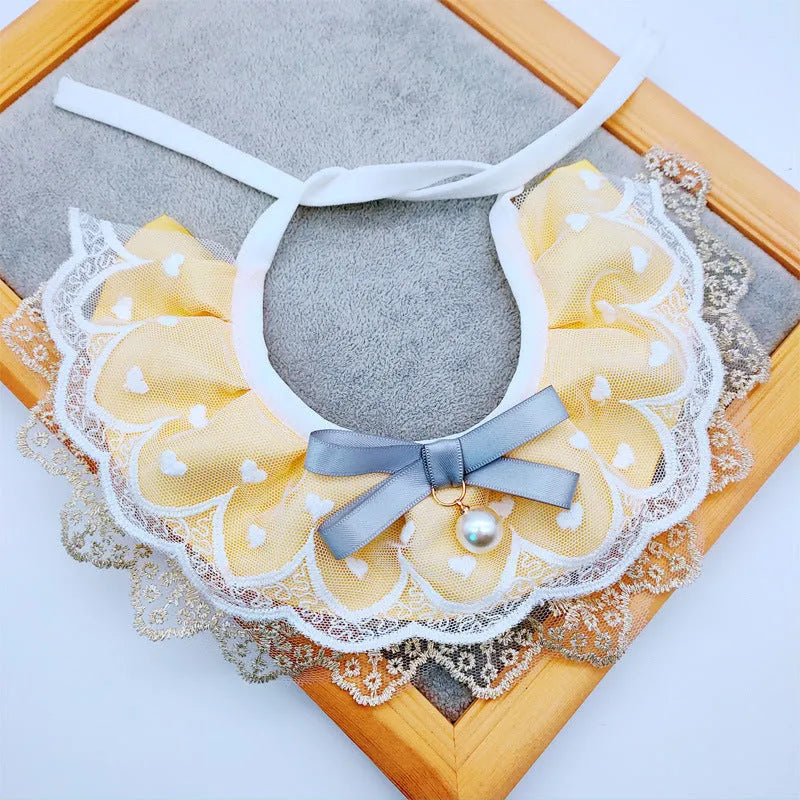 Yellow cat cotton bib with lace trim, princess style, on a white background showing front view with adjustable side lacing