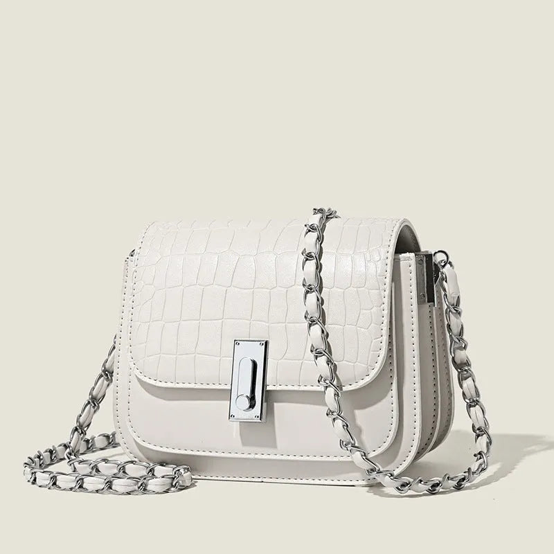 Soft PU leather women's crossbody shoulder bag in black, shown with a phone in the interior pocket.