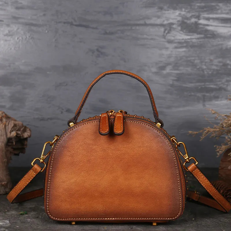Vintage suede cowhide leather handbag with multiple interior pockets including ID and phone slots.