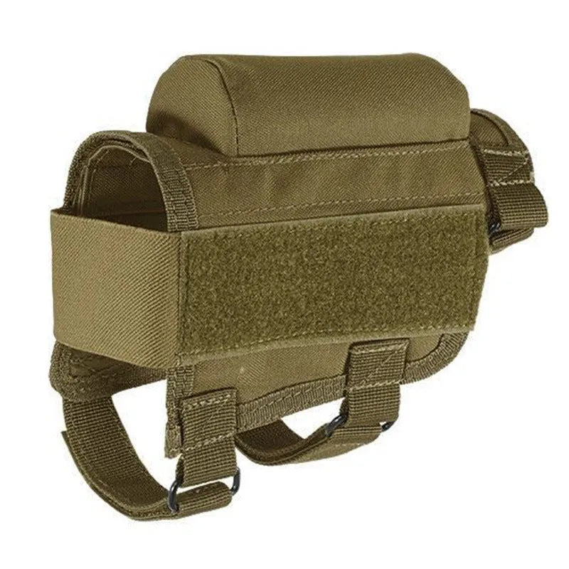 Tactical cheek rest with black nylon surface, hook and loop straps, and removable ammo carrier attached to a rifle stock