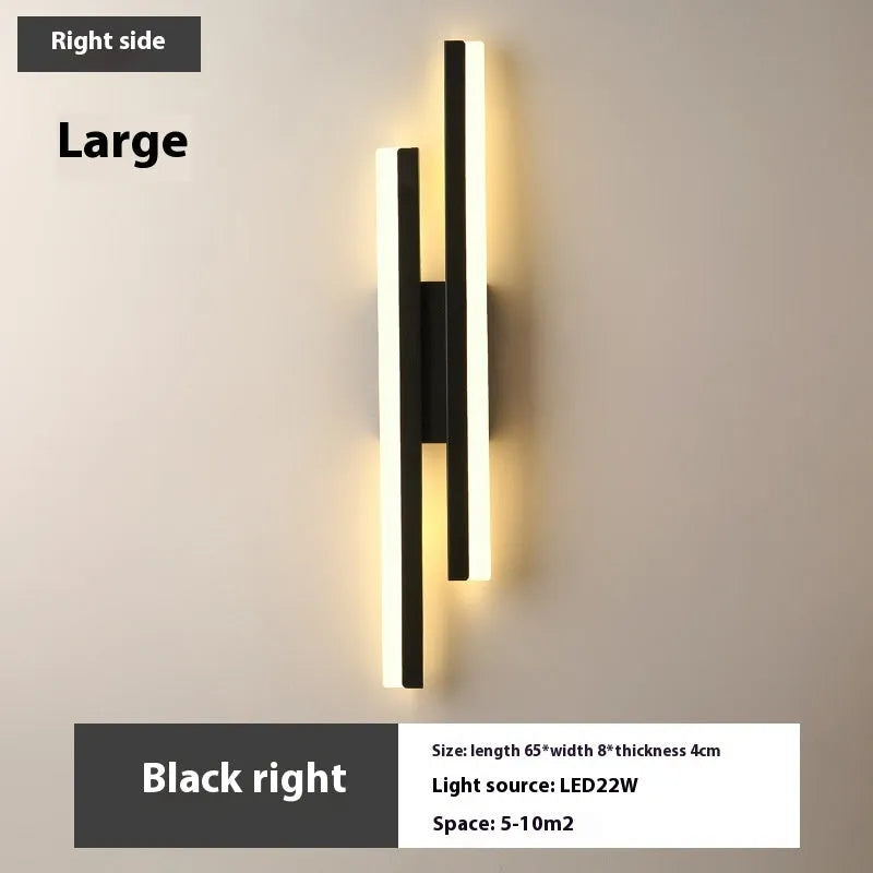 Minimalist Scandinavian-style LED wall light with acrylic shade in black or gold finish
