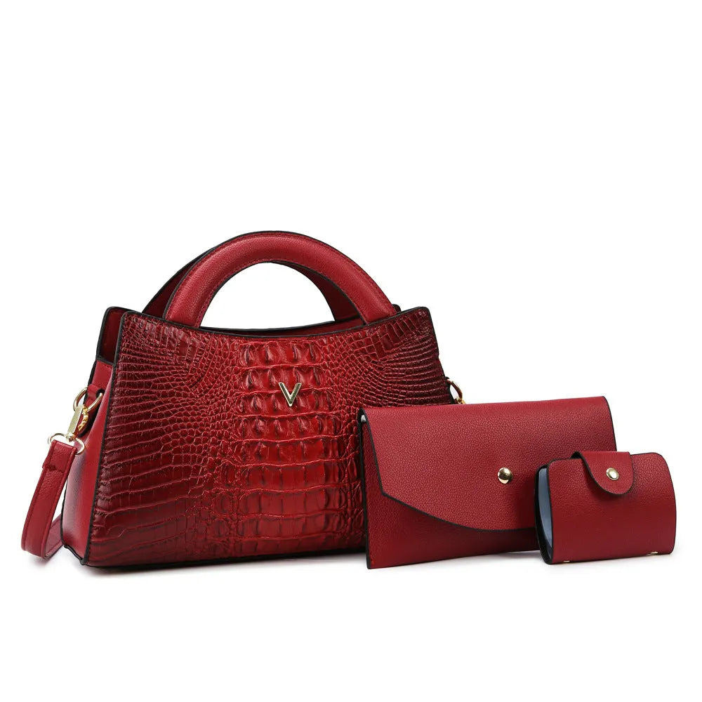 Women's black crocodile pattern PU crossbody handbag showing zip compartments and single shoulder strap.