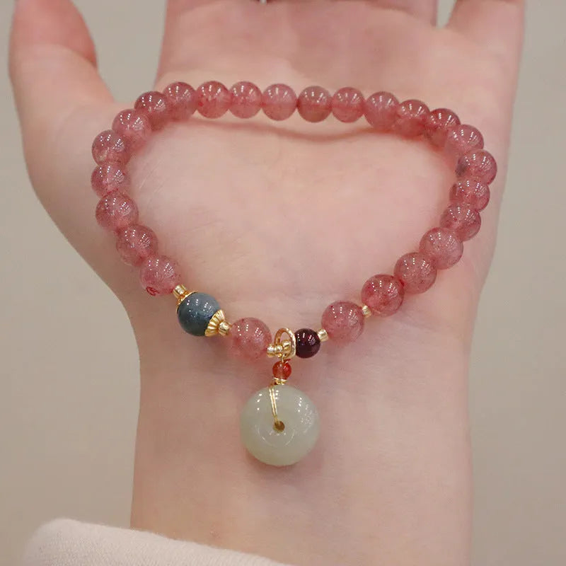 Strawberry quartz bracelet with geometric shapes, purse charm, and safety buckle closure