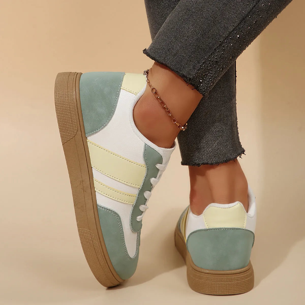 Women's green retro casual trainers with cross straps and round toe design on rubber sole