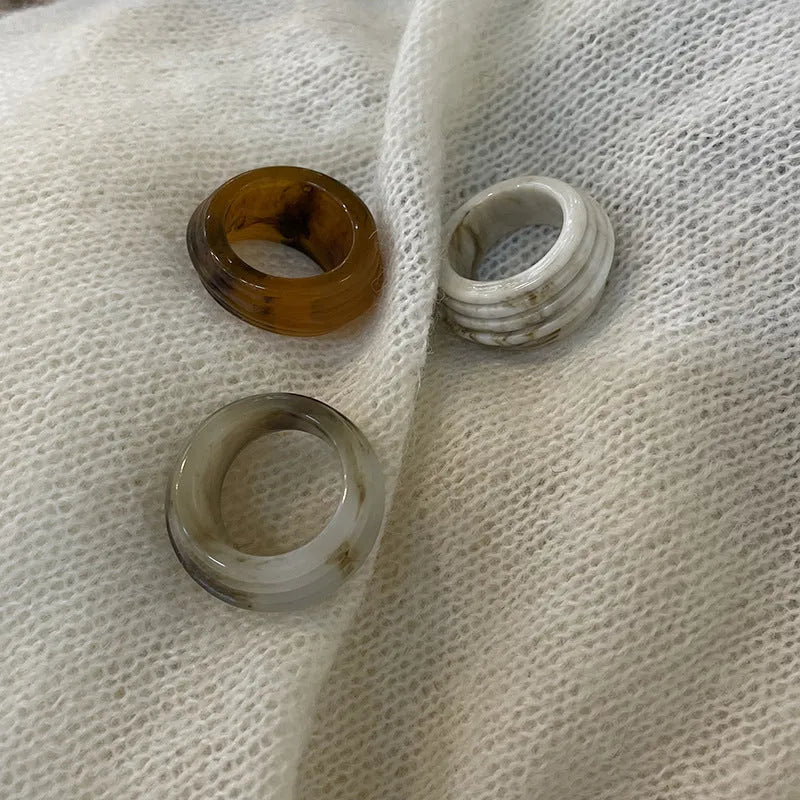 Chinese-style irregular geometric resin ring in brown and white colour options