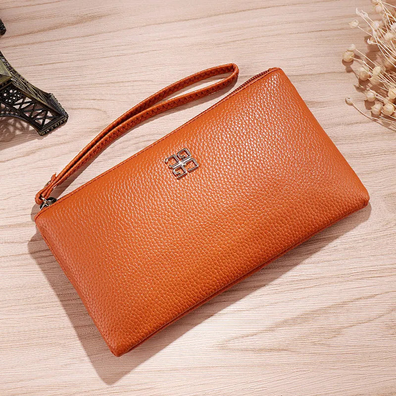 Long wine red PU leather phone wallet handbag with zip open showing card slots and phone compartment.