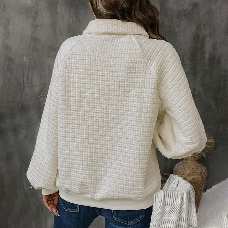 Milky white women's pullover sweater with a polo collar and textured knit fabric