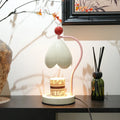 Linglan ancient style cream white melting wax fragrance lamp with metal holder on a desk
