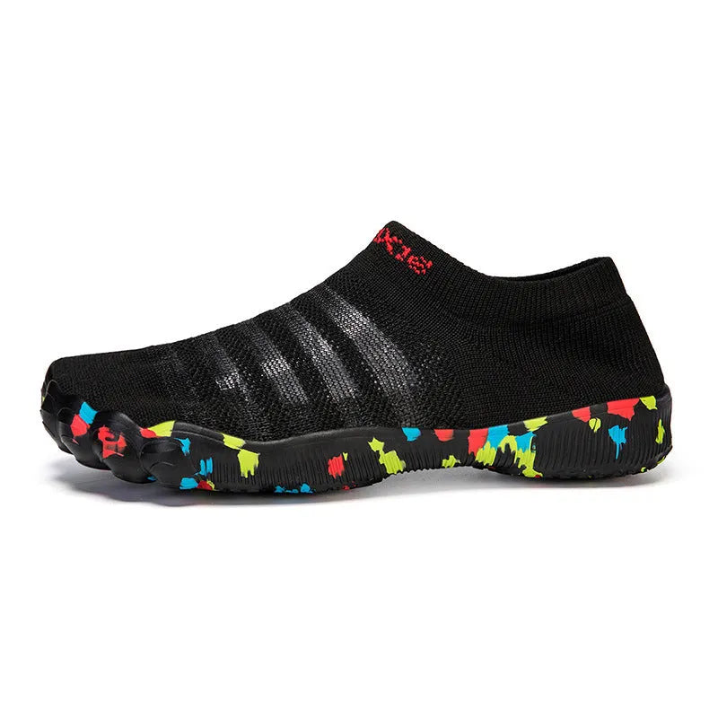 Flyknit water shoes in camouflage colour with flat rubber sole and lace-up front.