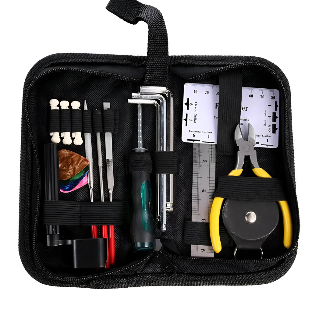 Open black guitar repair kit showing truss rod wrench, string action ruler, and cleaning tools in moulded plastic case