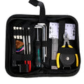 Open black guitar repair kit showing truss rod wrench, string action ruler, and cleaning tools in moulded plastic case