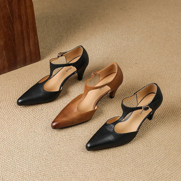 Brown retro women's T-strap sandals with buckle closure and a closed round toe.