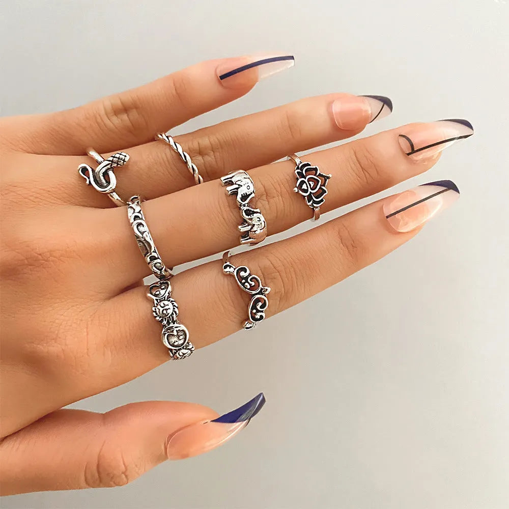 Alloy ring set with butterfly and snake retro geometric designs on display