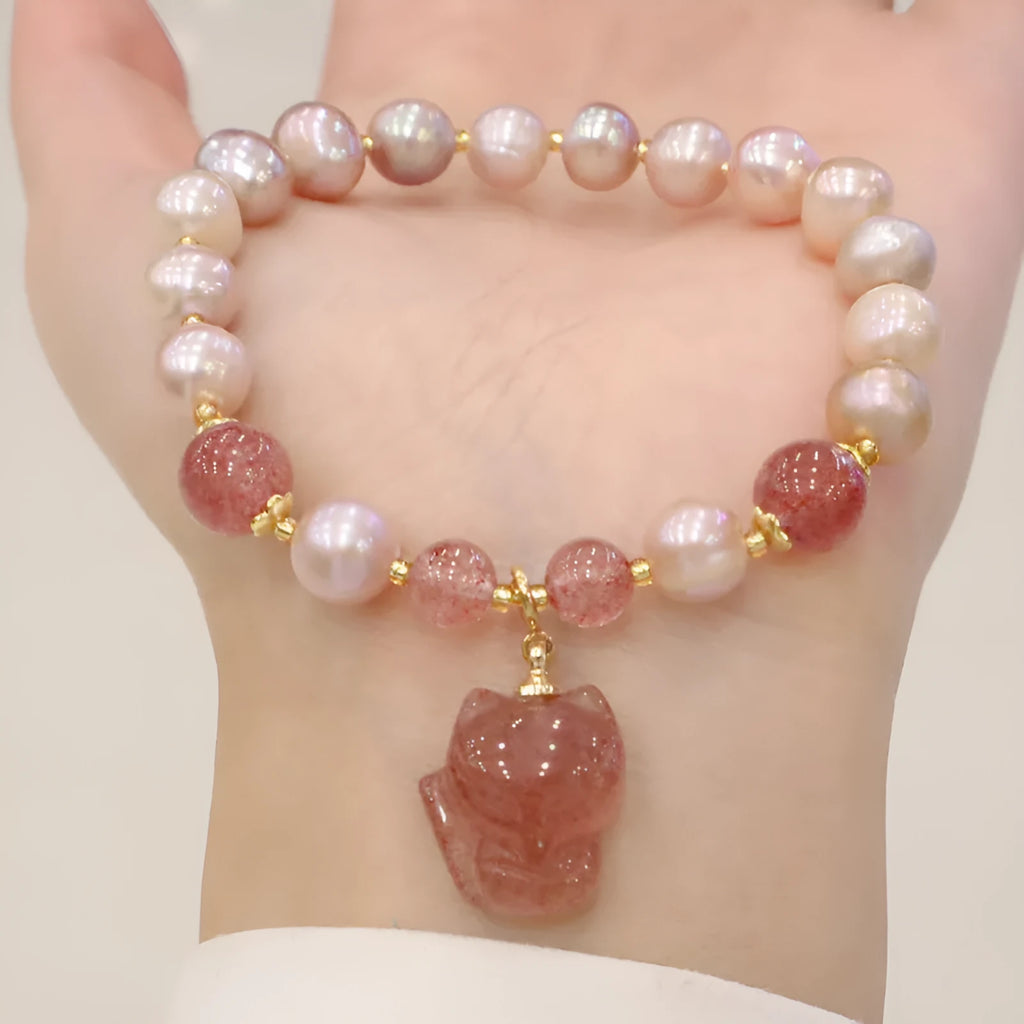 Women's light pink freshwater pearl bracelet with strawberry quartz beads and fox charm