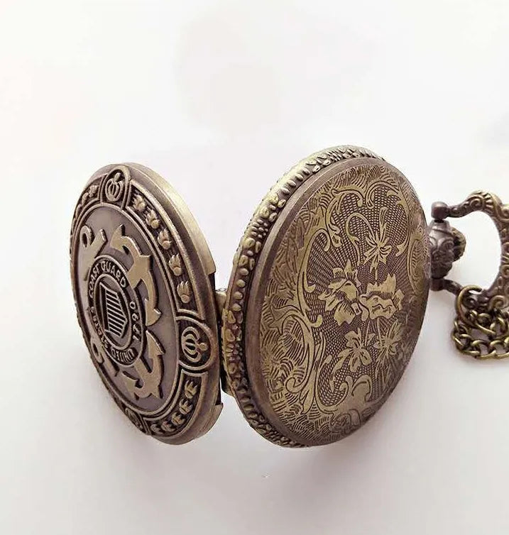 Bronze United States Coast Guard 1790 pocket watch with chain on light background