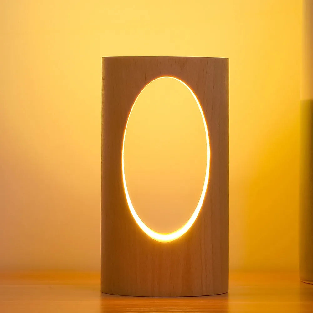 Solid wood LED reading lamp with glass lampshade on a desk, USB cable visible