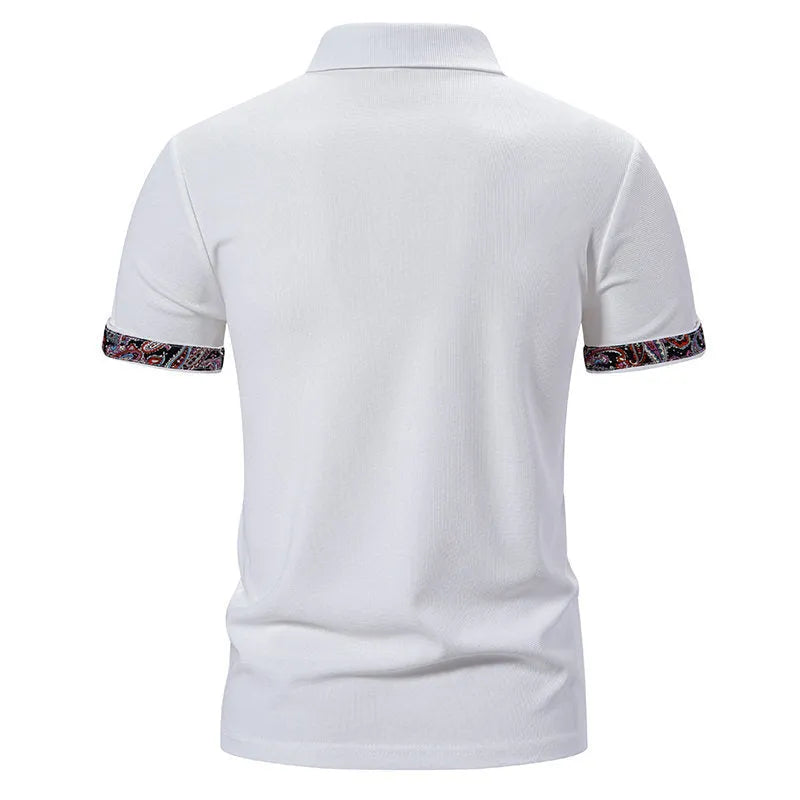 Men's navy blue polo shirt with colour block stitching on the chest and short sleeves.