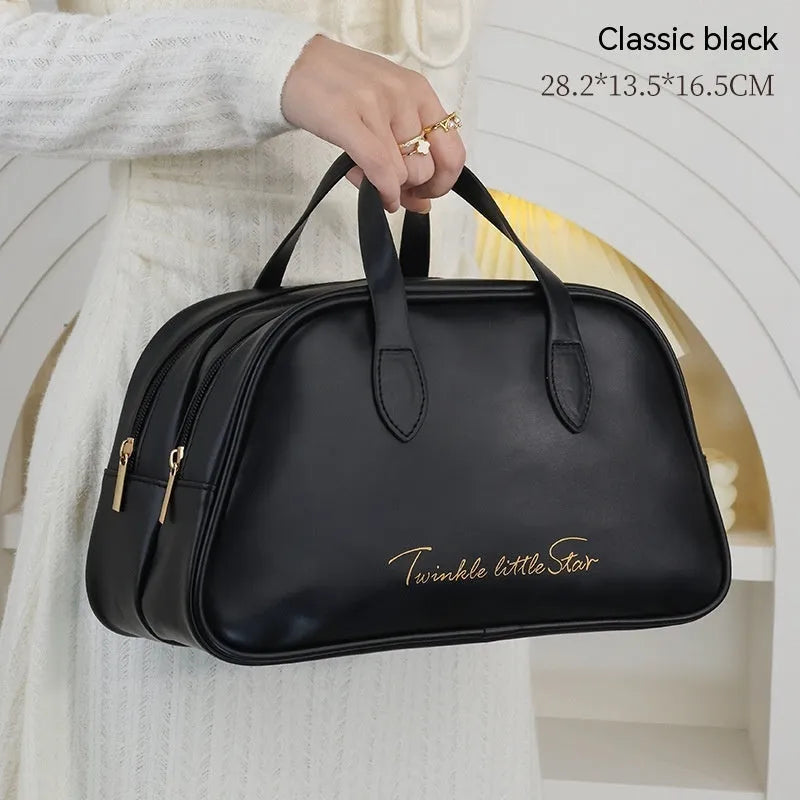 Leather travel toiletry bag open showing dry-wet separation compartments in caramel mocha colour