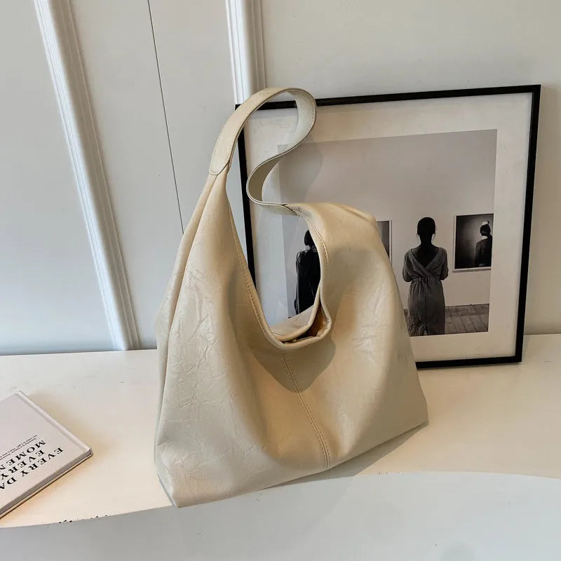 Soft PU leather shoulder bag with multiple external sandwich pockets in street-style design