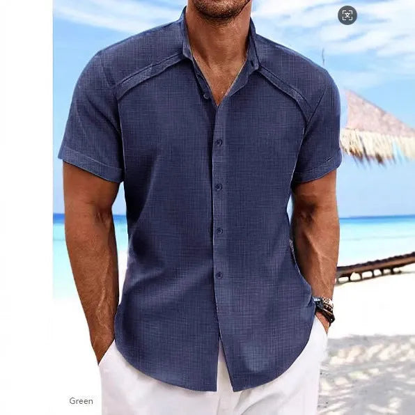 Man wearing a solid colour Hawaiian casual short sleeve shirt in a cotton blend fabric.