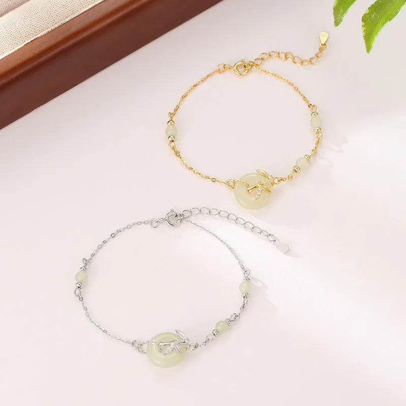 Women's antique-style silver bracelet with a peace buckle and adjustable safety clasp.