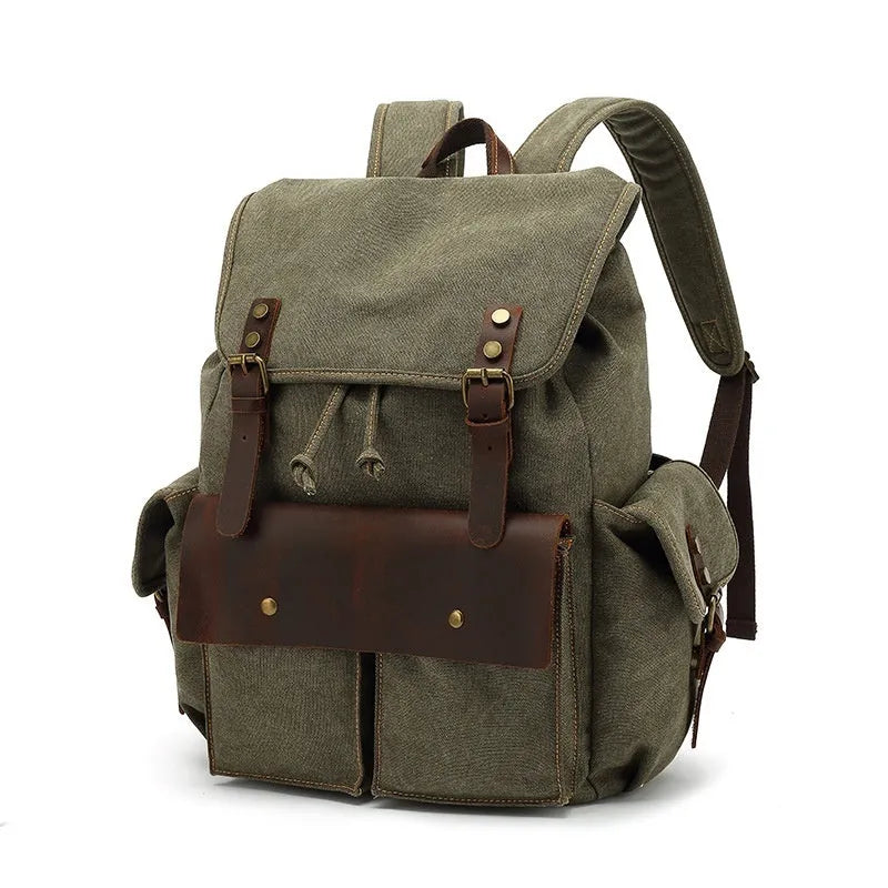 Retro canvas backpack in military green with antique bronze hardware showing front compartment organisation